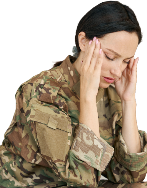 A woman in military uniform holding her head in thought, reflecting the need for support and care.
