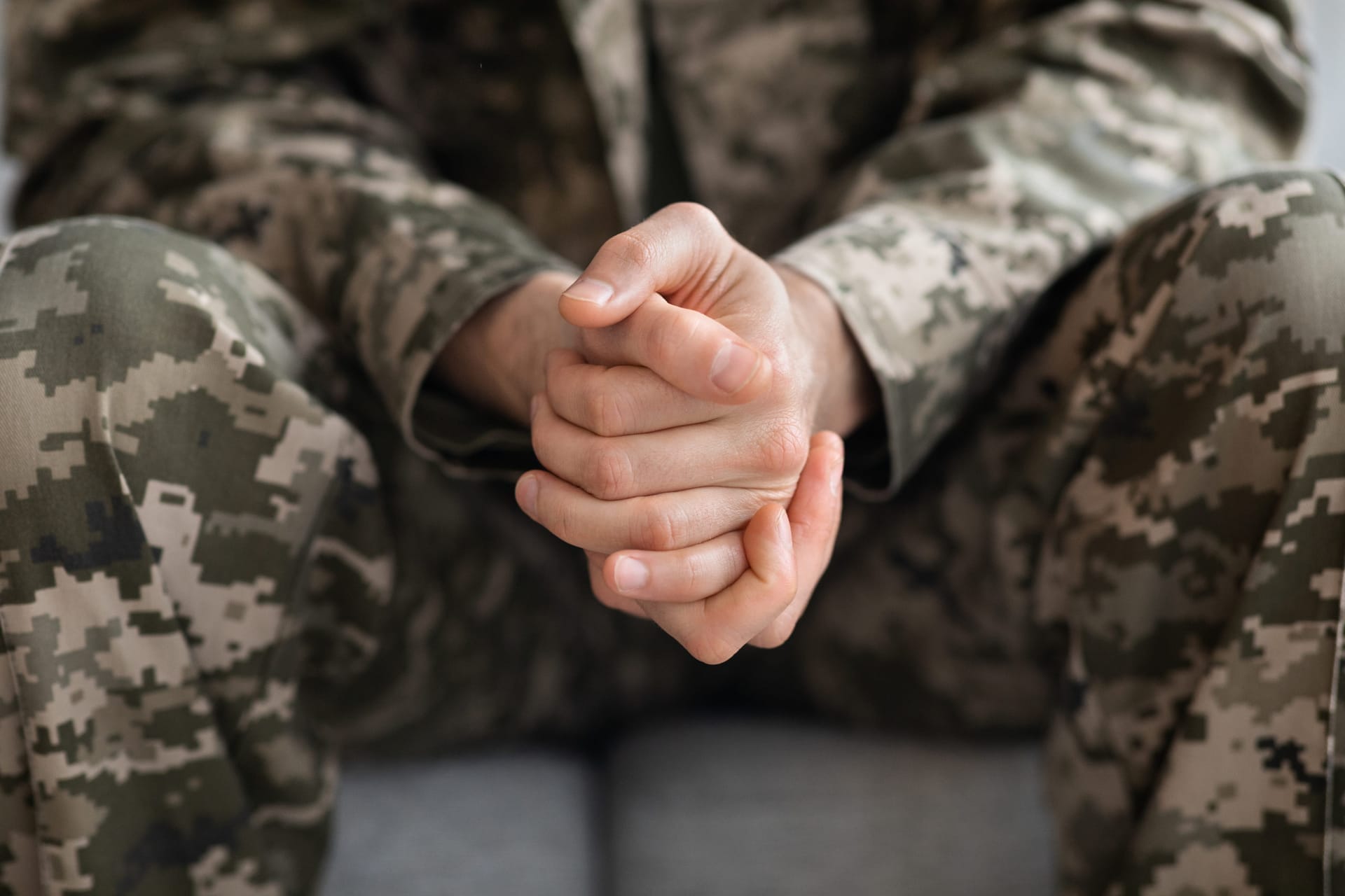 Veteran in Uniform with Hands Clasped
